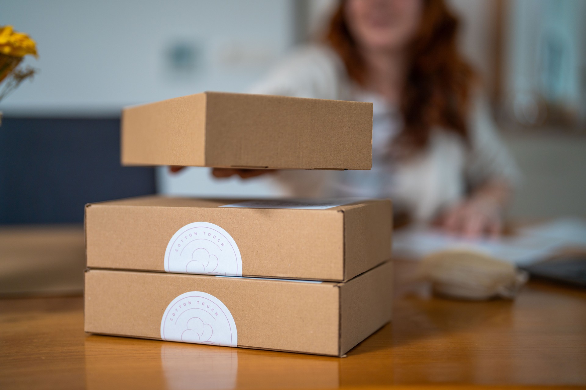 Mid Adult Woman Packing Products for Small Business